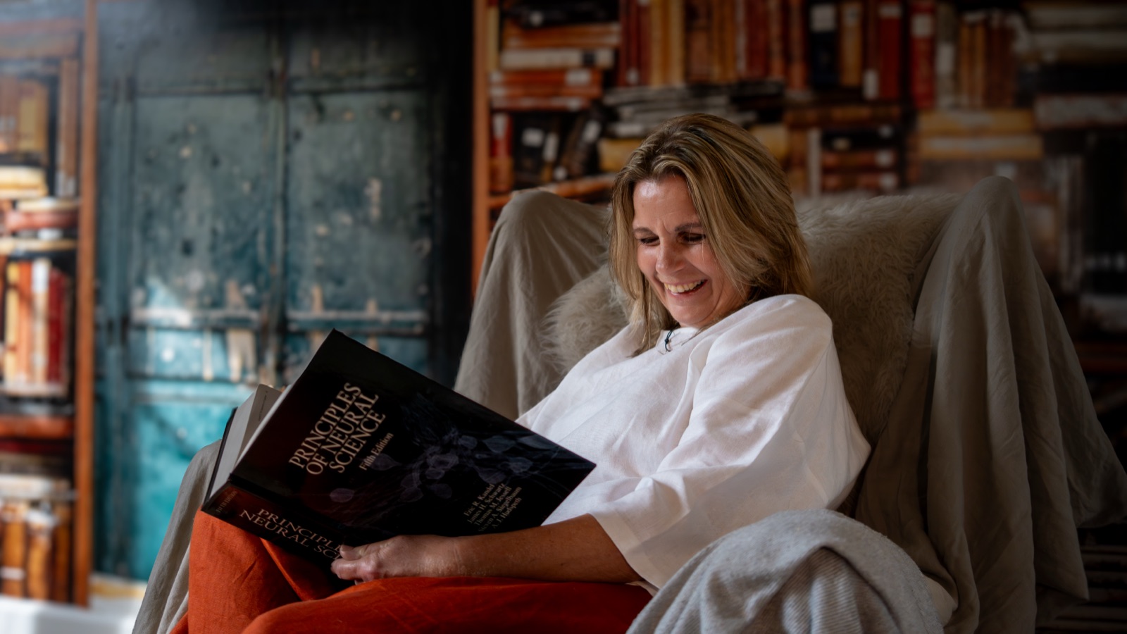 Annica reading in an armchair — a quiet moment of reflection